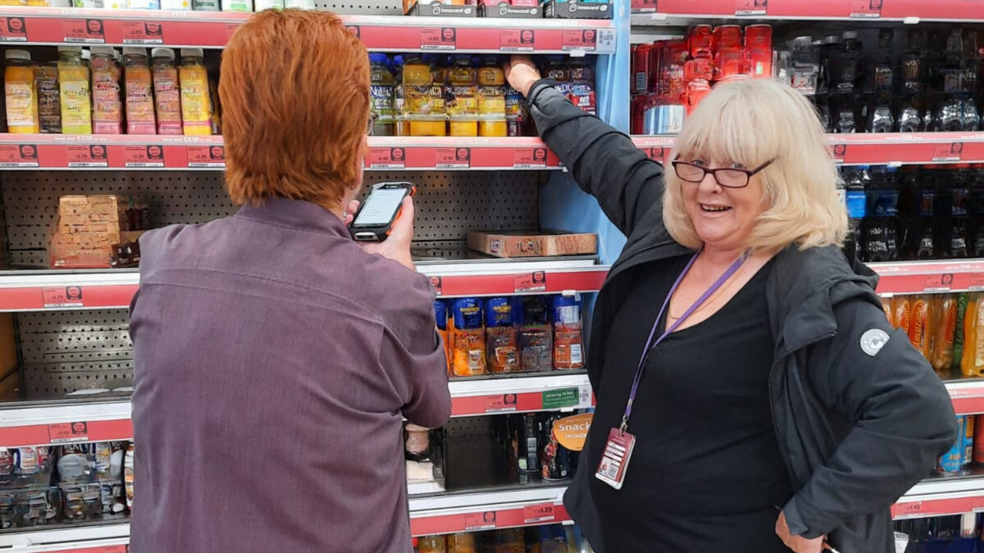women in front of supermarket shelves